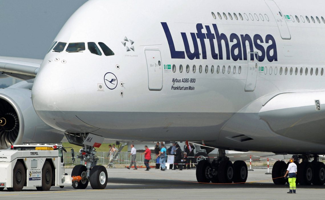BERLIN - JUNE 08:  A groundcrew member helps guide Lufthansa Airbus A380 passenger plane before take off at the ILA Berlin Air Show on June 8, 2010 in Berlin, Germany. The 2010 ILA will run from June 8-13.  (Photo by Sean Gallup/Getty Images)