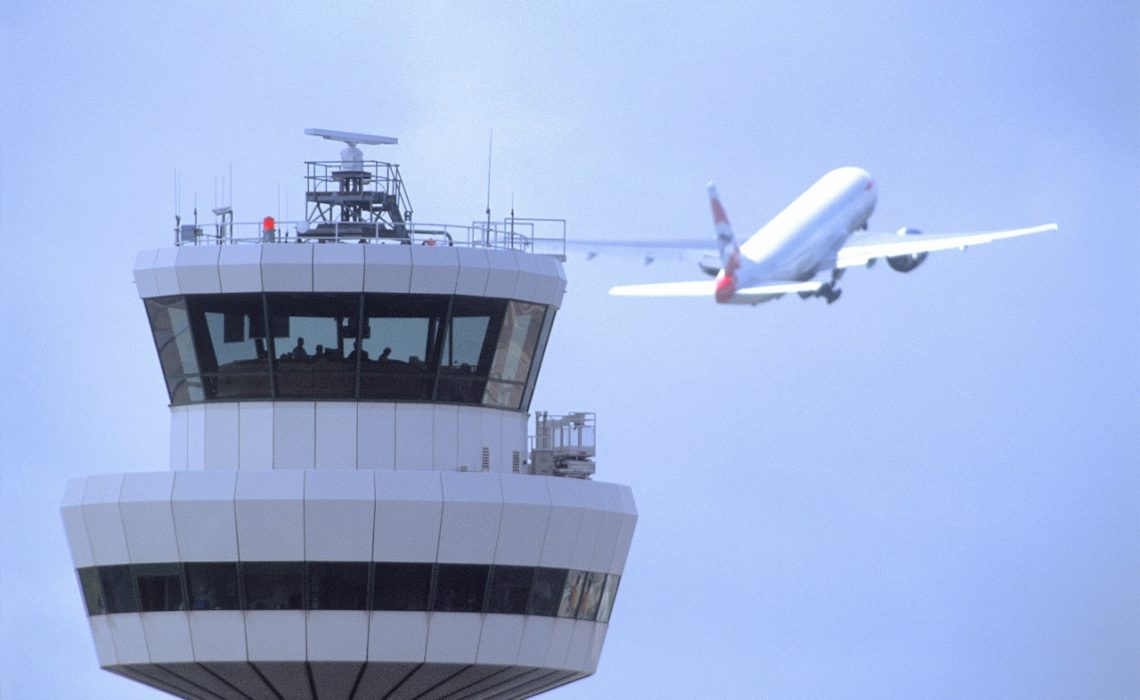 Gatwick Airport, Control tower with aircraft in flight in background, DP, 19 August 2004, (CGA857)